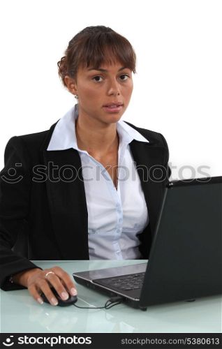 sweet-looking businesswoman working on laptop