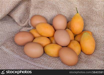 Sweet Marian plum thai fruit and egg on brown sack