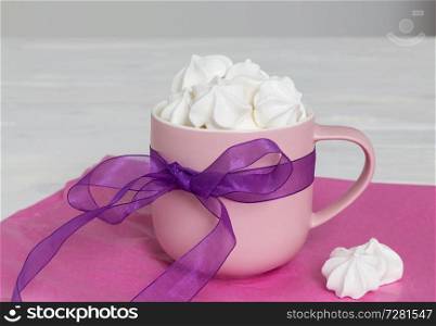Sweet meringue in cup as a gift.. Sweet meringue in cup as a gift