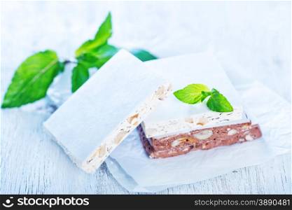 sweet nougat with nut on white paper