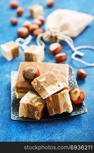 sweet nougat with nuts on blue tableware