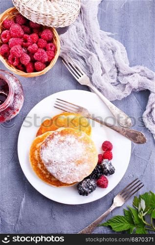 sweet pancakes with berries on the plate