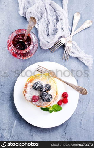 sweet pancakes with berries on the plate