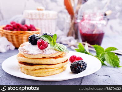 sweet pancakes with berries on the plate