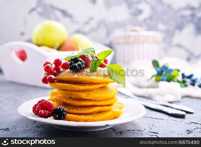 sweet pancakes with berries on the plate