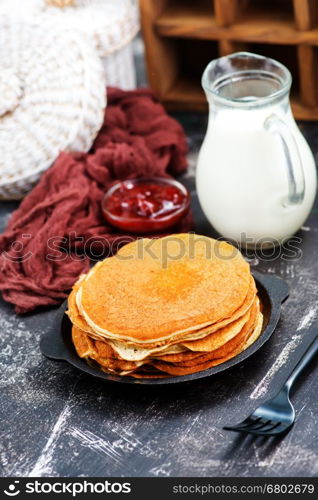 sweet pancakes with jam on the plate