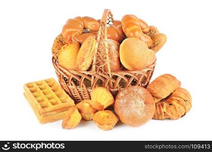 Sweet pastries, bread and flour products in a wicker basket isolated on white background.