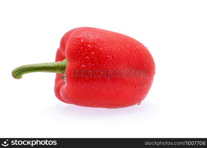 sweet pepper with drops of water on white background.