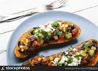 Sweet potato stuffed with vegetables and cottage cheese and baked in halves. Diet food, roast yam. Sweet potato stuffed with vegetables and cottage cheese.