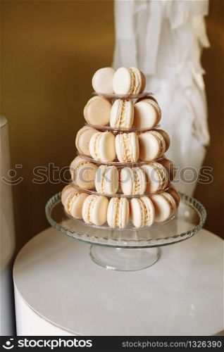 Sweet pyramid of the french macarons or macaroon for the birthday, event or wedding. selective focus.. Sweet pyramid of the french macarons or macaroon for the birthday, event or wedding. selective focus