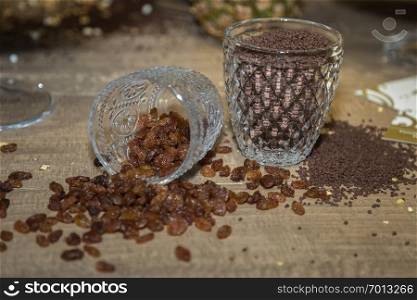 Sweet Raisin and Chocolate Granules in Glass Cups Used to Fill Cakes.. Sweet Raisin and Chocolate Granules in Glass Cups Used to Fill Cakes