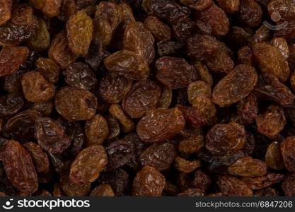 Sweet raisins background. Sweet dry raisins close up shot for background