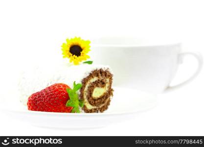 sweet roll lying on the saucer cup flower and strawberries isolated on white