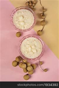 Sweet sticky rice with longan and coconut cream, thai style dessert. Sweet sticky rice with longan and coconut cream