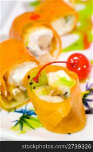 sweet sushi rolls with fruits, wrapped into rice paper, macro