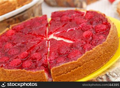 Sweet tart with red raspberries on a table