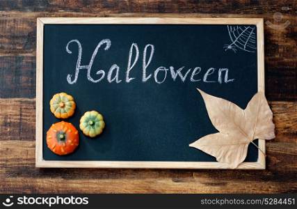 "Sweet terror is coming. Blackboard with the word "Halloween" "
