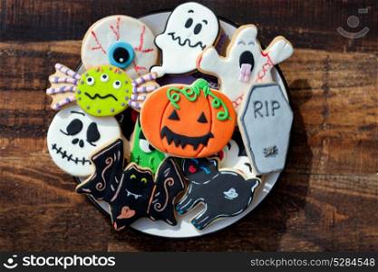 Sweet terror is coming. Funny Halloween cookies on a wooden background