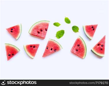 Sweet watermelon slices with mint leaves on white background