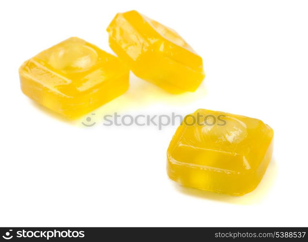 Sweet yellow citrus throat lozenge isolated on white