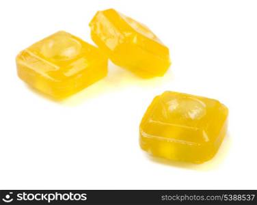 Sweet yellow citrus throat lozenge isolated on white