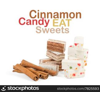 Sweets and cinnamon sticks isolated on white background