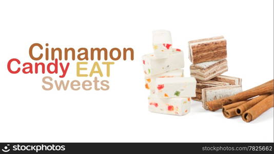 Sweets and cinnamon sticks isolated on white background