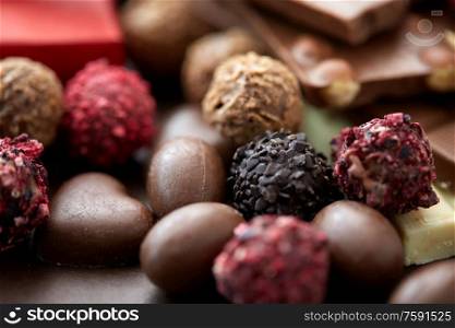 sweets, confectionery and food concept - close up of different chocolate candies. close up of different chocolate candies