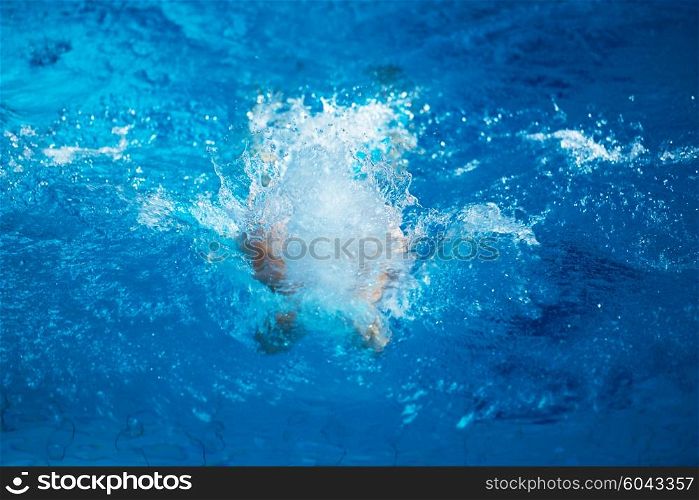 swimmer excercise on indoor swimming pool, sport and health concept