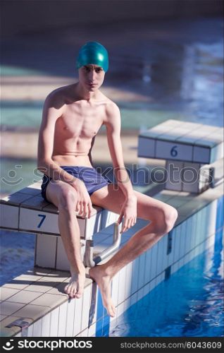swimmer excercise on indoor swimming pool, sport and health concept