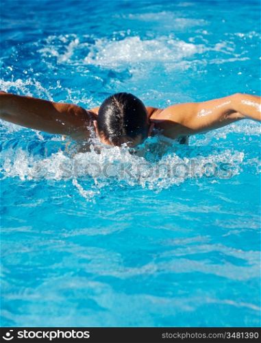 Swimmer in a swimming pool of clear water