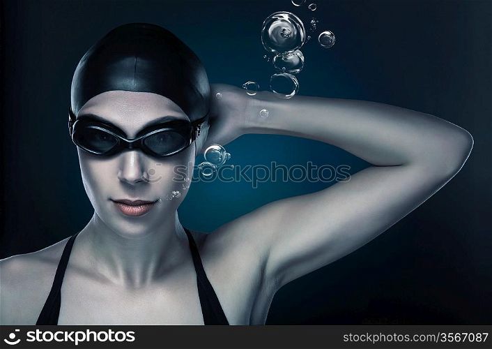 swimmer in dark blue light