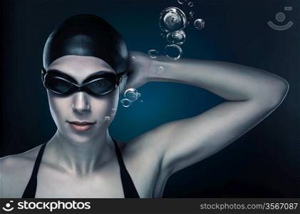 swimmer in dark blue light