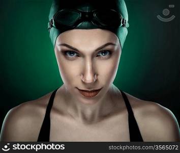 swimmer in dark green light