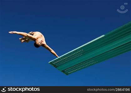 Swimmer Jumping into Swimming Pool