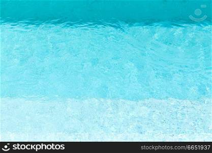 swimming and background concept - turquoise water in pool. turquoise water in swimming pool