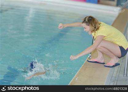 swimming coach cheering at the leisure center