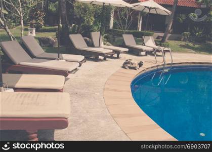 Swimming pool beautiful in tropical resort - Vintage tone.