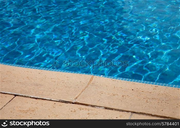 swimming pool blue water detail in summer time