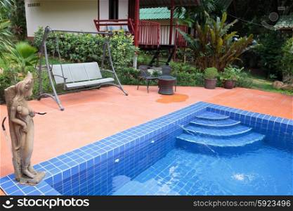 Swimming pool in a tropical garden