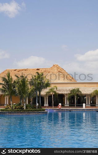 Swimming pool in front of a tourist resort, Cancun, Mexico