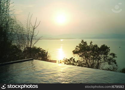 Swimming pool terrace and beautiful nature view ,sunset on Khuean Srinagarindra National Park at Kanchanaburi , Thailand and sky for travel in holiday relax time