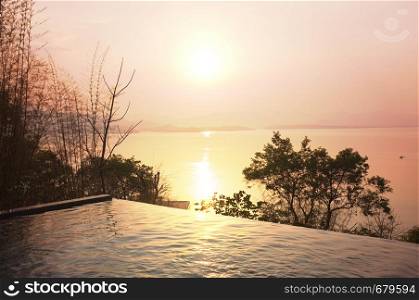 Swimming pool terrace and beautiful nature view ,sunset on Khuean Srinagarindra National Park at Kanchanaburi , Thailand and sky for travel in holiday relax time
