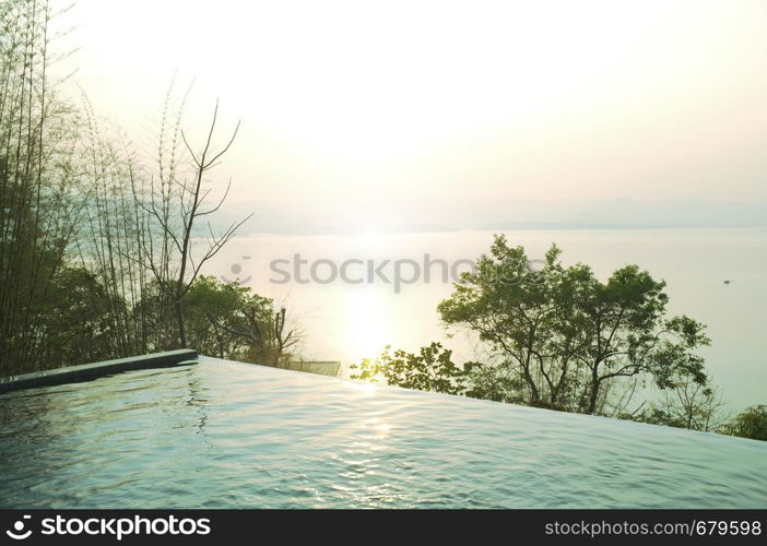 Swimming pool terrace and beautiful nature view ,sunset on Khuean Srinagarindra National Park at Kanchanaburi , Thailand and sky for travel in holiday relax time