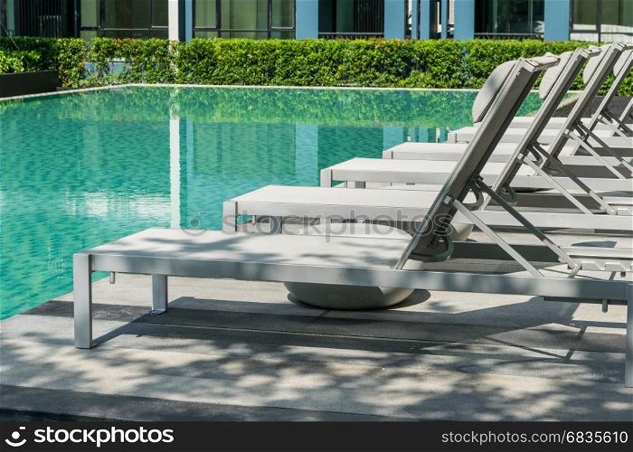 Swimming pool with beach chairs