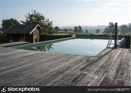 swimming pool with vieuw on the hills of the border between belgium and netherlands