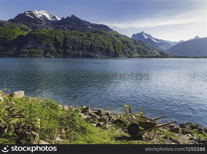 Swiss Alps mountains and the Walensee lake, in canton St. Gallen, near Weesen, Switzerland. Sunny summer alpine landscape. Vacation destination.
