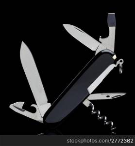 Swiss army knife isolated on black