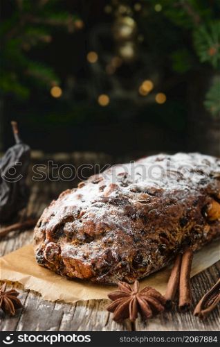 Swiss Christmas Pear Bread - Bundner Birnbrot or Paun cun paira, a local dish filled with dried pears, fruits and nuts. Selective focus. Pie close-up on a wooden table. New Year?s tea party