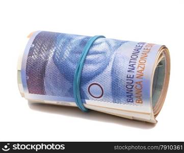 Swiss francs in a roll on white background